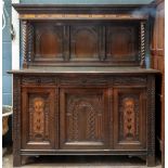 A late Victorian foliate carved oak dresser, in 17th century style, of panelled construction,
