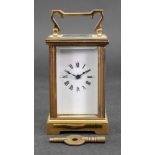 A miniature brass cased carriage timepiece, 20th century, in a pillared case,