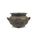 A large Chinese two-handled bronze jardiniere, circa 1900, cast in relief with fish in a pond,