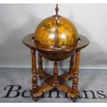 A 20th century globe drinks cabinet, on turned supports