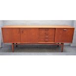 G PLAN, a mid-20th century teak sideboard on turned supports, 206cm