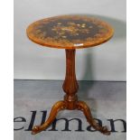 A Victorian marquetry inlaid circular occasional table, on reeded baluster and tripod base,