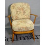 Ercol, a mid-20th century beech low open armchair, 68cm wide x 76cm high.