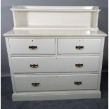 An early 20th century white painted chest of two short and two long drawers, on plinth base,