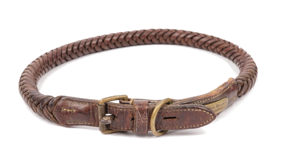 A leather and brass mounted dog collar with applied plaque detailed 'H.R.H. THE DUKE OF GLOUCESTER'.