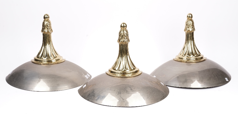 A set of three gilt metal and chrome wall mounted up-lighters of dished demi-lune form with fluted