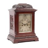 A Victorian mahogany cased mantel clock with silvered dial, subsidiary strike/silent,