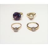 A 9ct gold ring, claw set with a circular cut synthetic corundum imitating alexandrite, a 9ct gold,