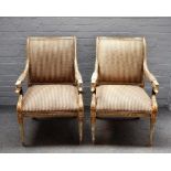 A pair of 18th century style French open armchairs, with eagle head arm supports on turned legs,