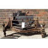 An Empire style bowfront fire grate with steel urn finials, 101cm wide,