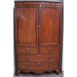 A George IV mahogany bowfront mahogany linen press,