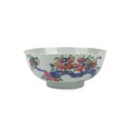 A Chinese famille rose bowl, Qianlong, painted with fruiting branches and flowers,