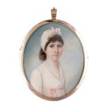 Georgian gold mounted miniature of a lady in a pink dress, reverse of woven hair, 8cm.