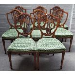 A set of eight late 19th century marquetry inlaid mahogany shield back dining chairs,
