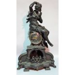 An early 20th century spelter figural mantel clock, 45cm wide x 74cm high.