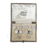 A gold and mother-of-pearl gentleman's evening wear dress set, comprising; a pair of cufflinks,