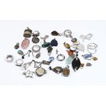 A group of mostly silver mounted jewellery, comprising; twenty-five pendants and charms,