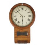 A oak cased drop dial wall clock, early 20th century, with 12 inch tin dial,