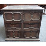 A small Charles II oak chest of four short over one long geometric moulded drawers,