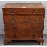 A mid-18th century walnut chest, with four long graduated drawers on bracket feet,