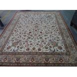 A part silk Ghom carpet, Persian, the ivory field with a minor central medallion, corner designs,