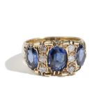 A gold, synthetic sapphire and diamond ring,