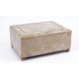 A tessellated marble cigar box by Maitland Smith, raised on spherical brass bun feet, 36cm wide.