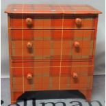 An early 20th century tartan painted pine chest, of three long graduated drawers,