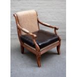 A Regency style open armchair, on sabre supports, 73cm wide x 95cm high.