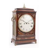 An early 19th century mahogany and brass inlaid bracket clock,