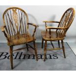 A set of six 18th century style stained beech wheelback chairs, to include two carvers,