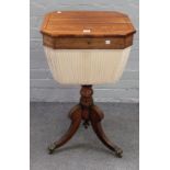 A Regency brass inlaid rosewood lift top work table, on three downswept supports,