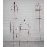 A pair of wrought iron garden obelisks with globular finials, each approximately 210cm high,