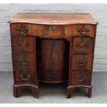 A George III mahogany dressing table, of serpentine outline,