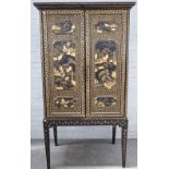 A 19th century Chinese export black lacquer chinoiserie decorated cabinet on stand,