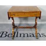 A Victorian mahogany and brass inlaid drop flap writing table, on dual ended lyre supports,