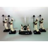 Four modern composition figural candle holders,