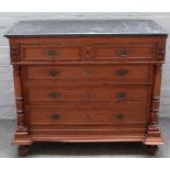 A late 19th century French marble top pitch pine commode, with two short over three long drawers,