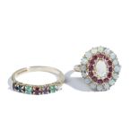 A 9ct gold, opal and ruby oval cluster ring, claw set with an oval opal to the centre,