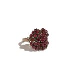 A gold and ruby cluster ring, claw set with circular cut rubies,