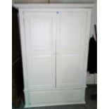 A modern white painted pine double wardrobe, with single drawer base, 126cm wide x 183cm high.