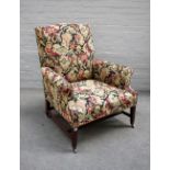 A George III mahogany framed tapestry upholstered easy armchair, on tapering square supports,