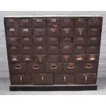 A metal bound hardwood forty-four drawer apothecary chest, on plinth base, 126cm wide x 108cm high.