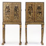 A pair of 19th century Chinese export black lacquer chinoiserie decorated cabinets on stands,