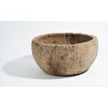 A circular dug out burr wood bowl, probably 19th century, 44cm diameter x 23cm high.