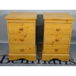 A pair of modern pine bedside chests, with three short drawers, 44cm wide x 74cm high.