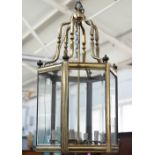 A Victorian style gilt metal hall lantern of hexagonal form,