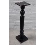 An ebonised jardiniere stand, with square top and turned column, 98cm high.