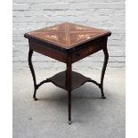 An Edwardian marquetry inlaid rosewood envelope card table, on cabriole supports,