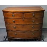 A late George III mahogany bowfront chest, with two short and three long graduated drawers,